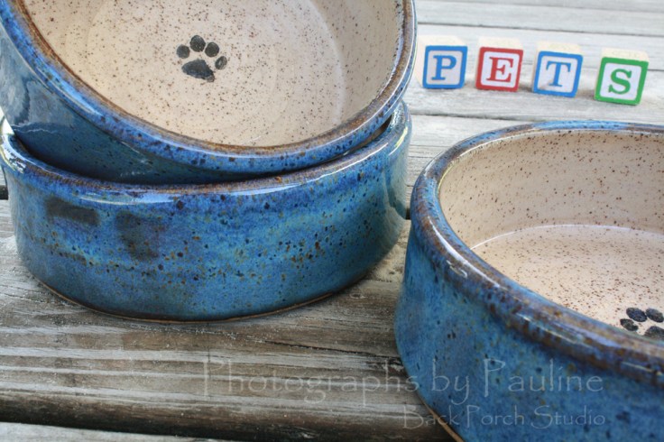 Blue and cream pet dishes available in various sizes. 